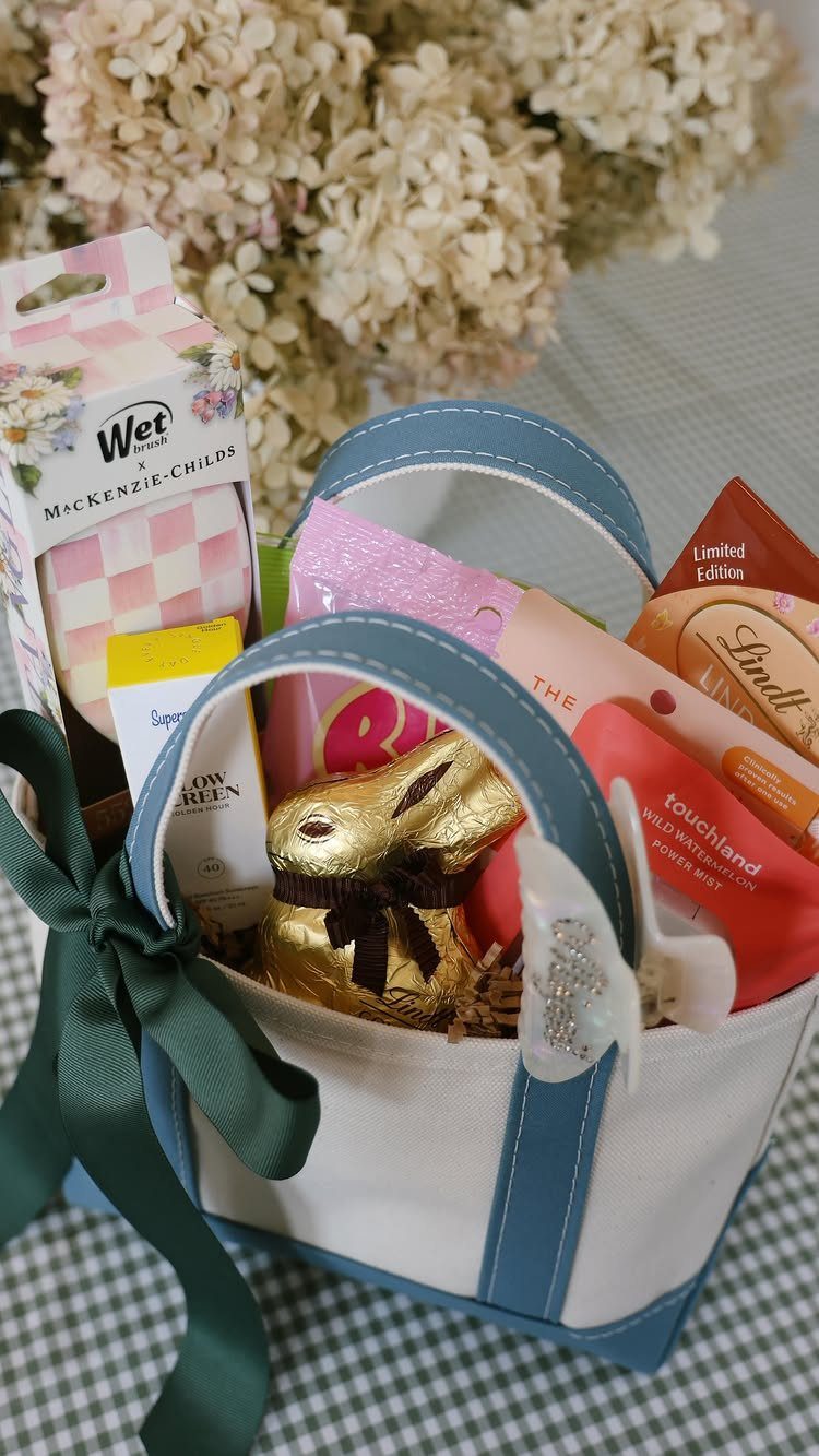 White canvas Easter basket filled with gold chocolate bunny and beauty products.