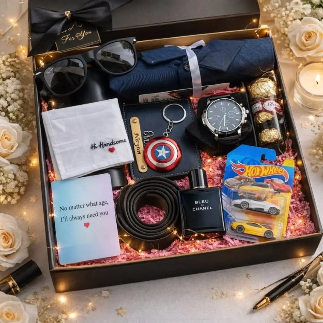 Black gift box filled with men's accessories, snacks, and a blue shirt.
