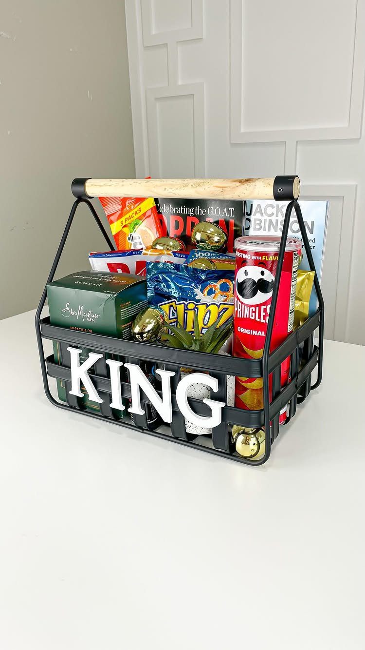 Black wire basket filled with snacks and gold eggs with KING text on front