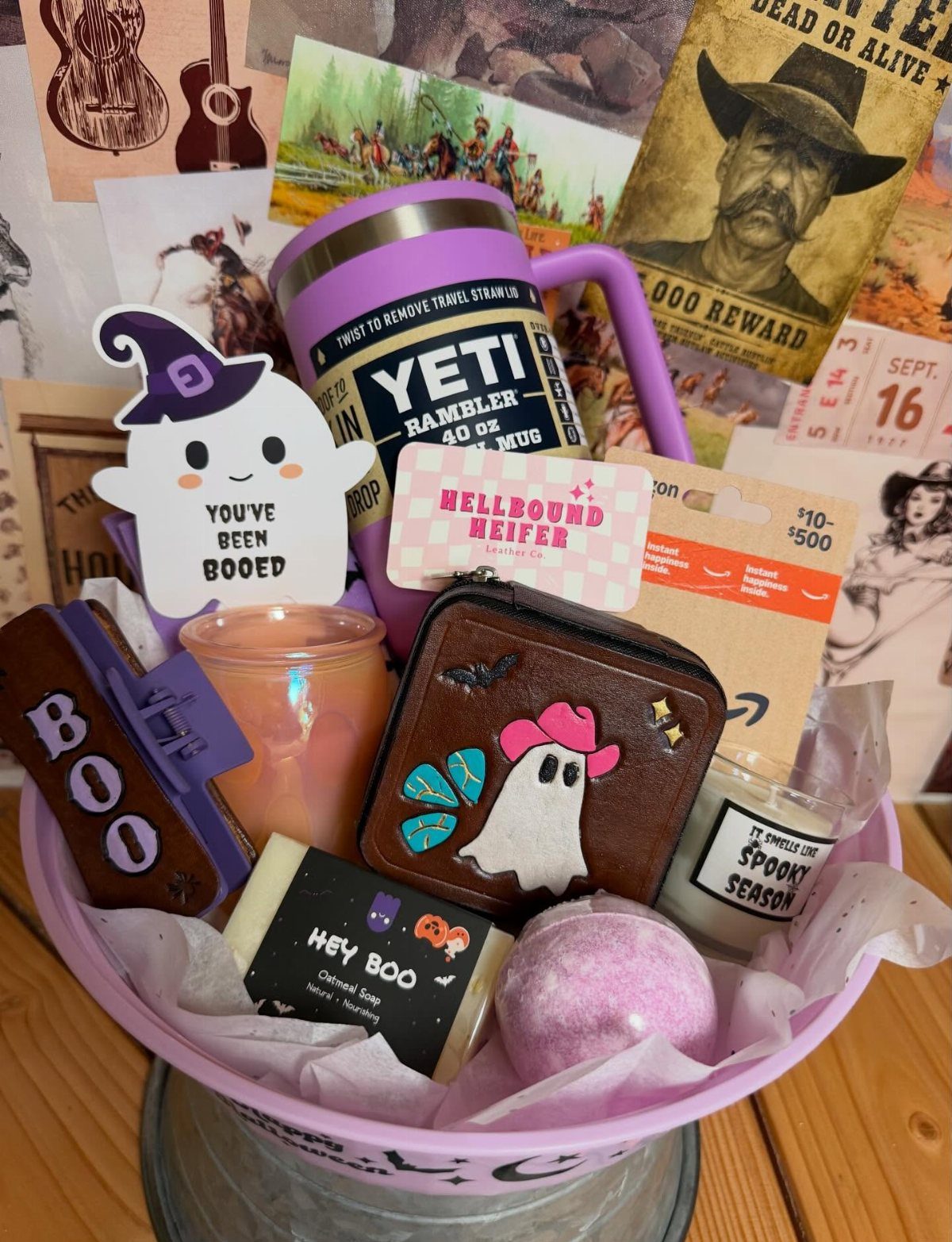Halloween boo basket with purple Yeti tumbler, ghost accessories, and spooky themed bath products.
