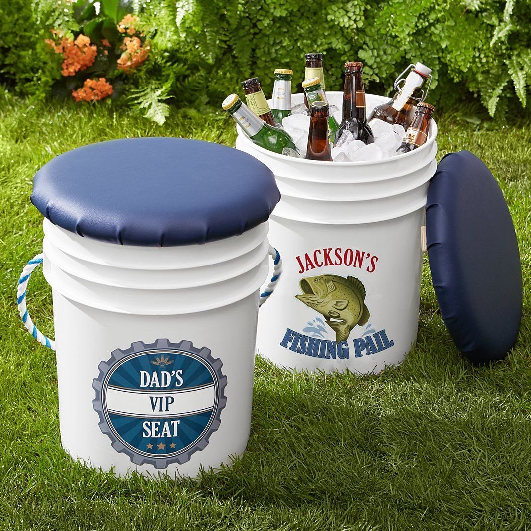 Two white plastic buckets, one as a seat and one as a beer cooler.