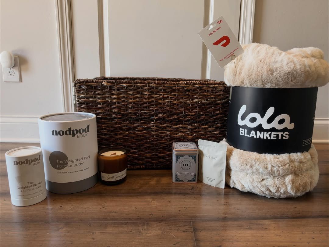 Cream plush blanket and care items arranged next to a brown wicker basket.