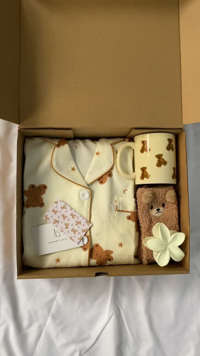 Cream pajamas with brown bears in a gift box with a matching mug.