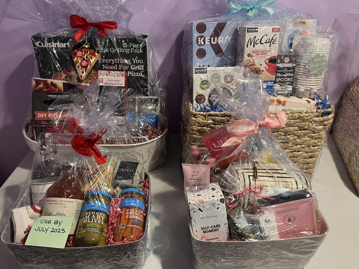 Four wrapped gift baskets including a DIY pizza kit and coffee themed sets.