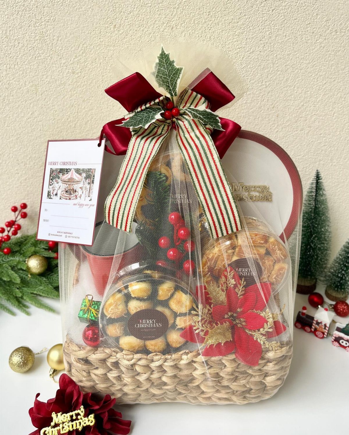 Gourmet food gift basket wrapped in cellophane with a festive red bow.