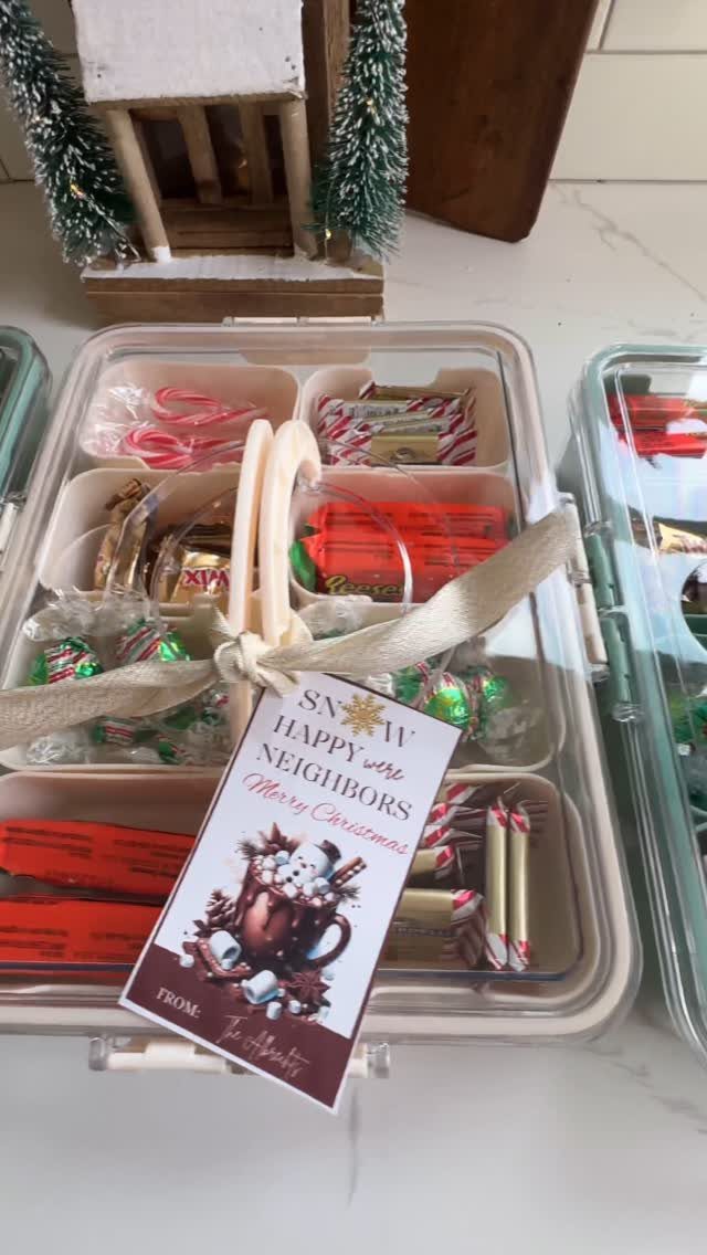 Christmas gift container for neighbors filled with candies and a festive tag.