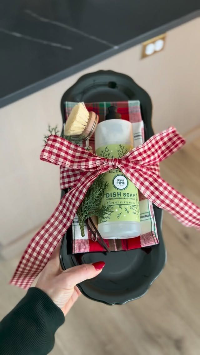 Dish soap and scrub brush in a black tray tied with gingham bow