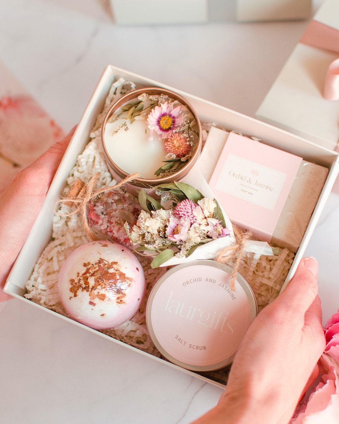 Spa gift set with bath bomb, candle, and salt scrub in white box