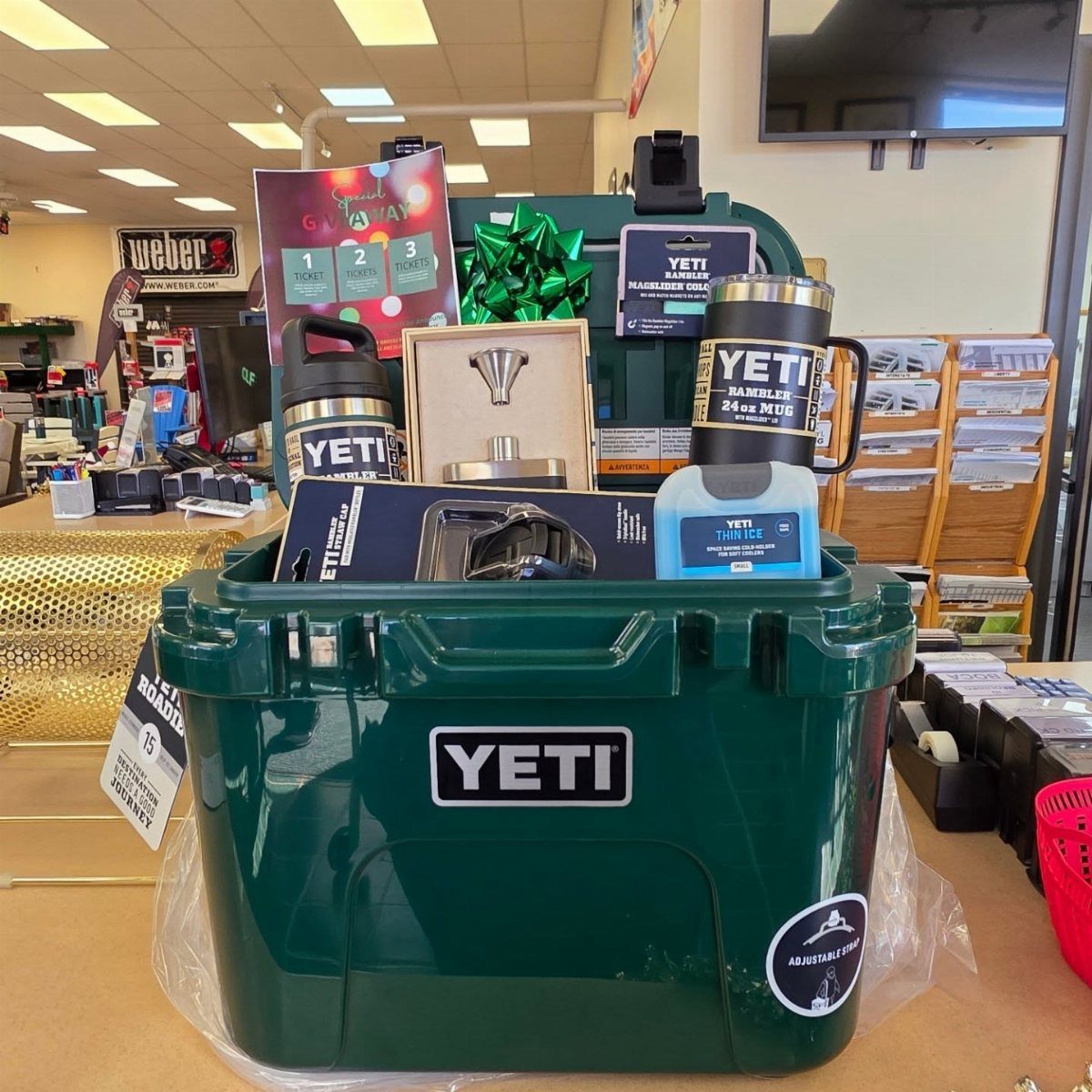 Green Yeti cooler filled with outdoor gear and accessories for a raffle prize.
