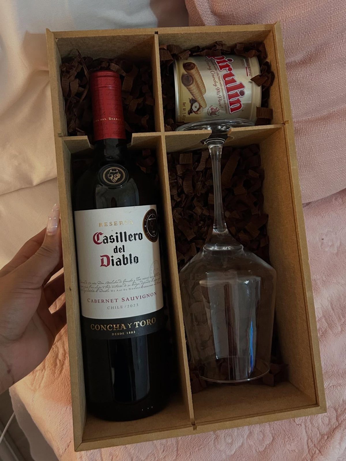 Wine gift box with a red wine bottle, wine glass, and wafer tin.
