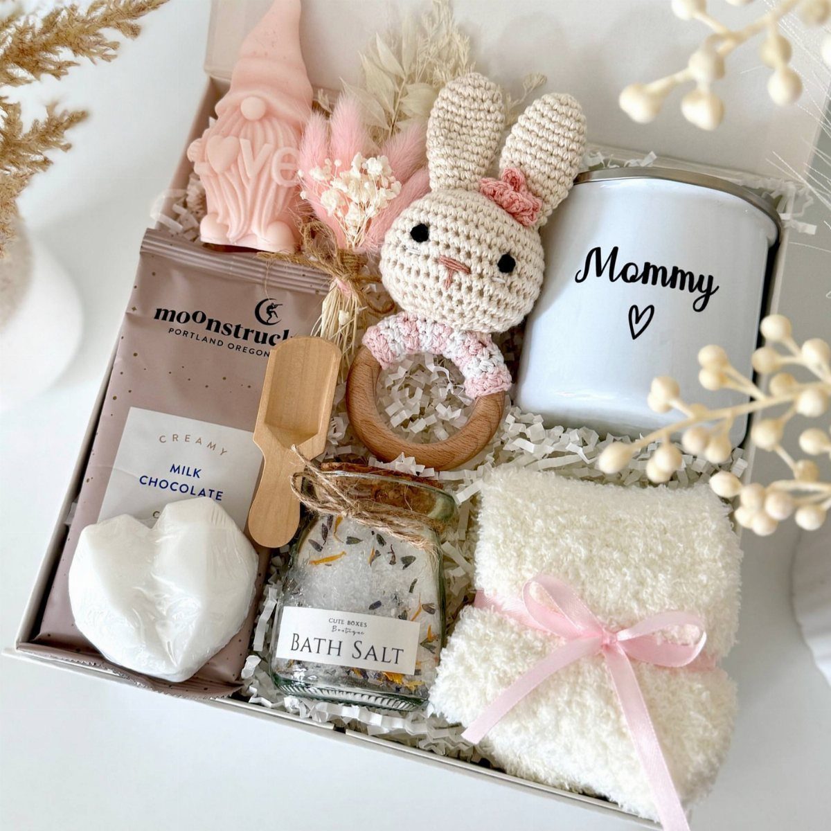 Gift box for new mothers containing a Mommy mug, bunny toy, and bath salts.