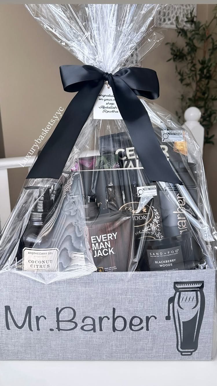 Grooming products in a grey Mr. Barber gift basket wrapped in clear cellophane.