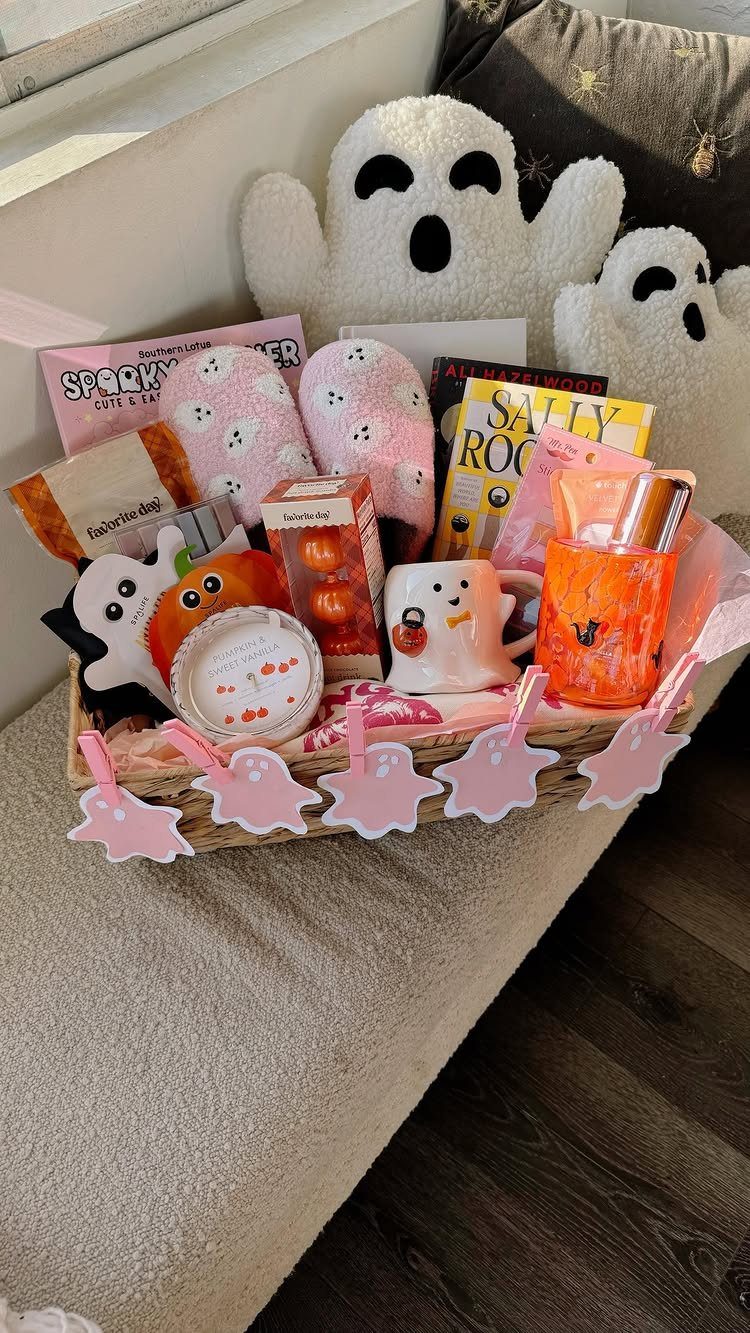 Halloween gift basket with ghost slippers, a ghost mug, and plush ghost toys.