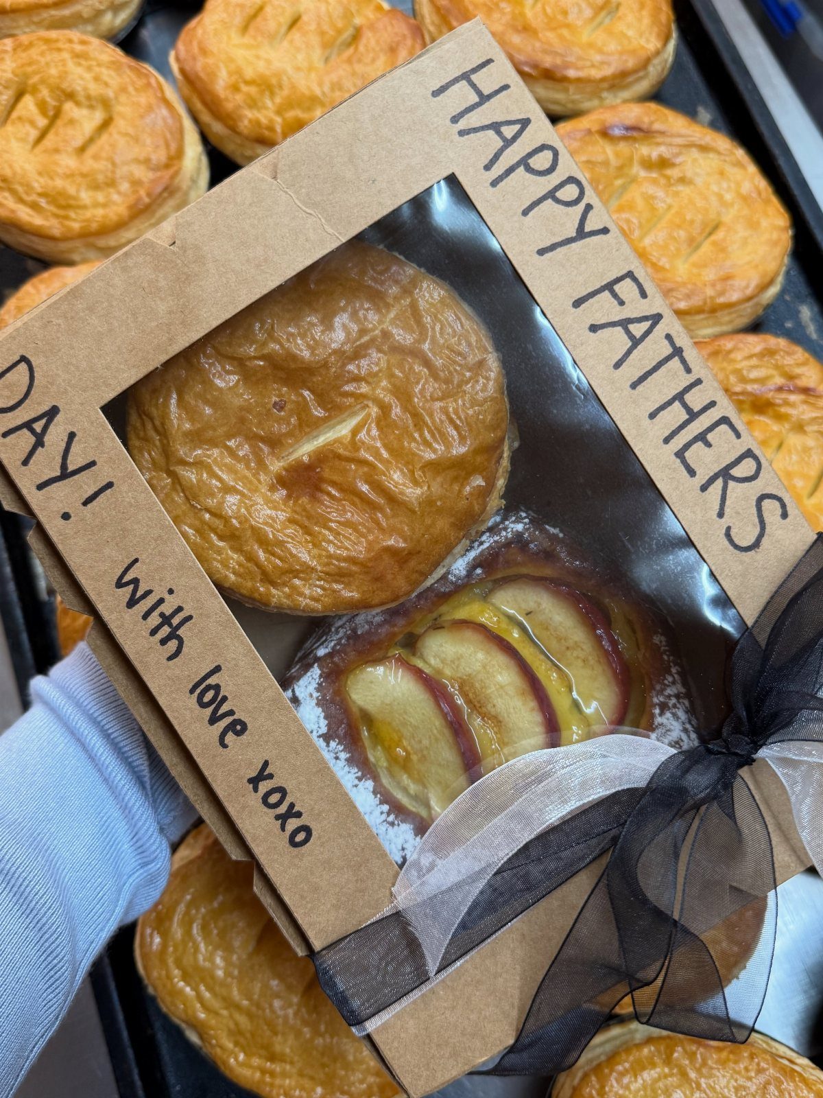 Cardboard gift box with savory pie and apple tart for Father's Day