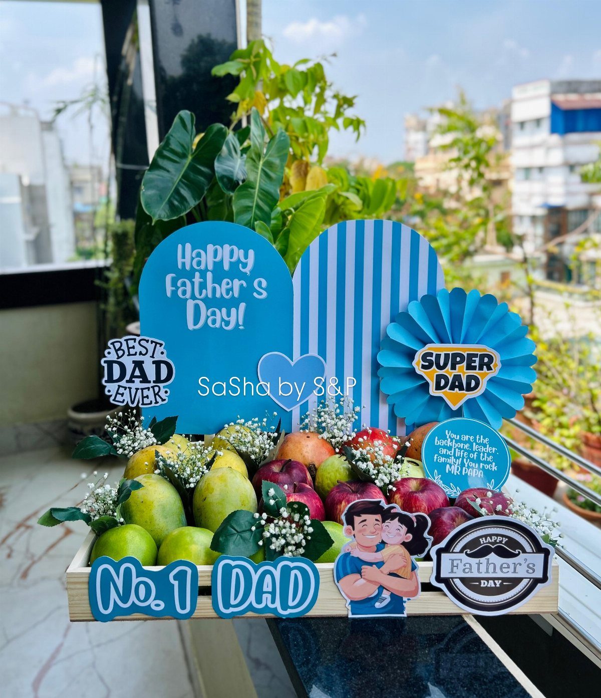 Fruit gift basket with apples and pears and Father's Day signs in a crate.