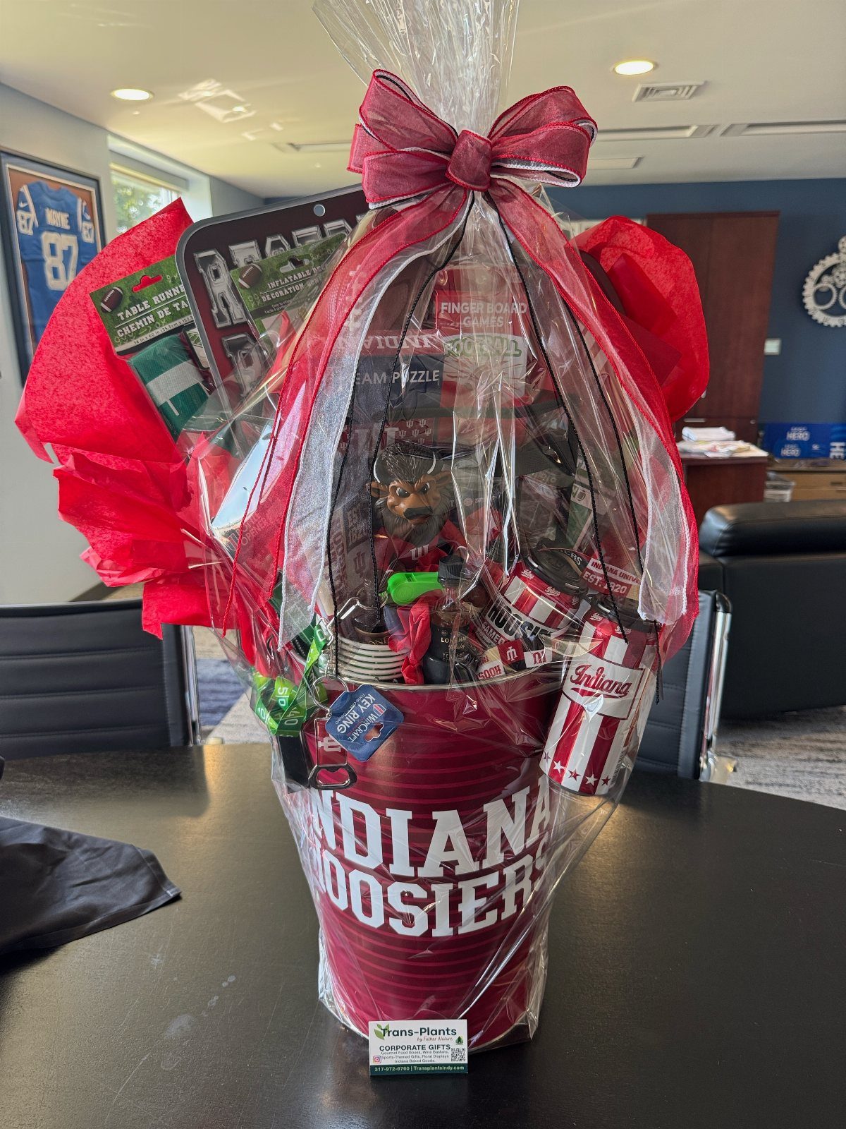 Indiana Hoosiers sports fan gift basket in a red bucket with cellophane wrap