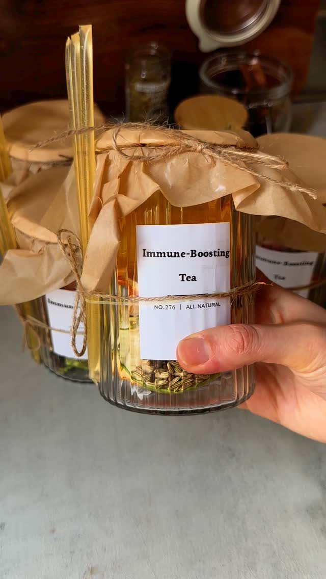 Immune-boosting tea in a glass jar with a brown paper tied lid.
