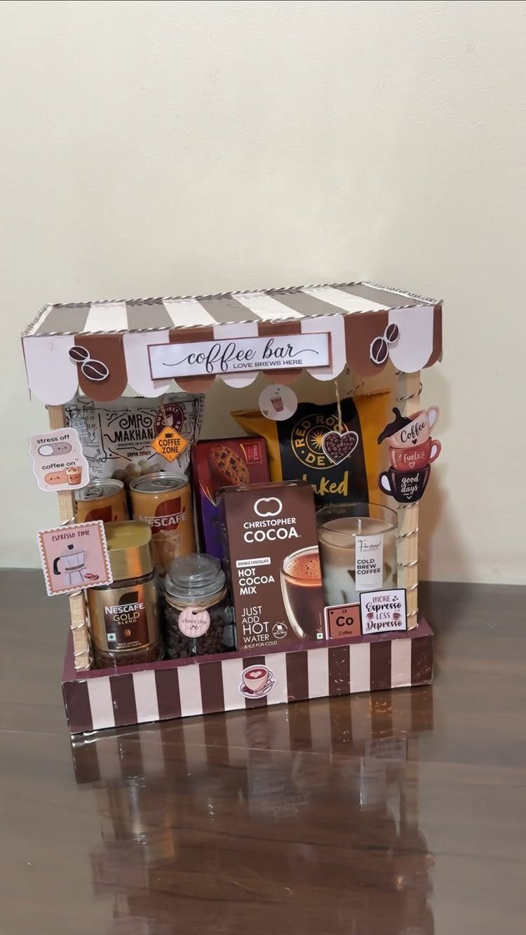 Coffee-themed gift basket styled as a miniature coffee bar with various caffeine treats.