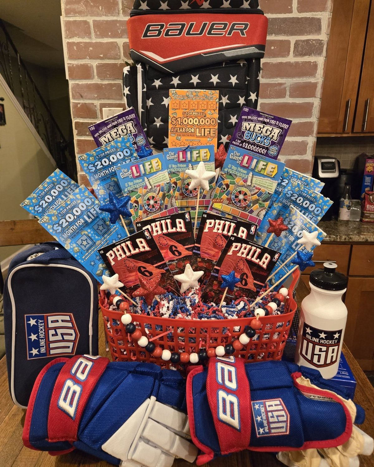 Lottery tickets in a red basket surrounded by blue and red hockey gear.