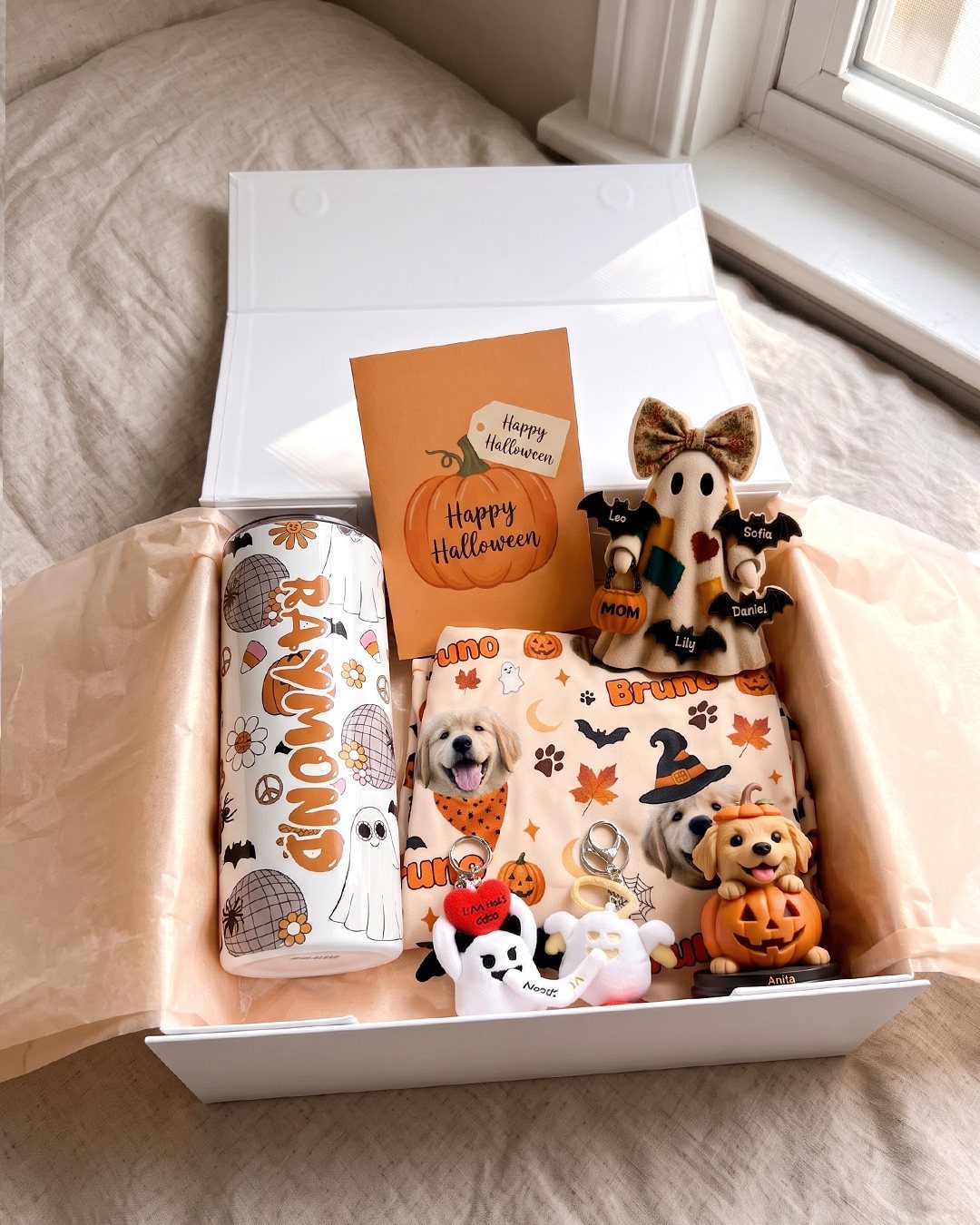 Halloween gift box containing a tumbler, ghost plushie, and dog-themed accessories.