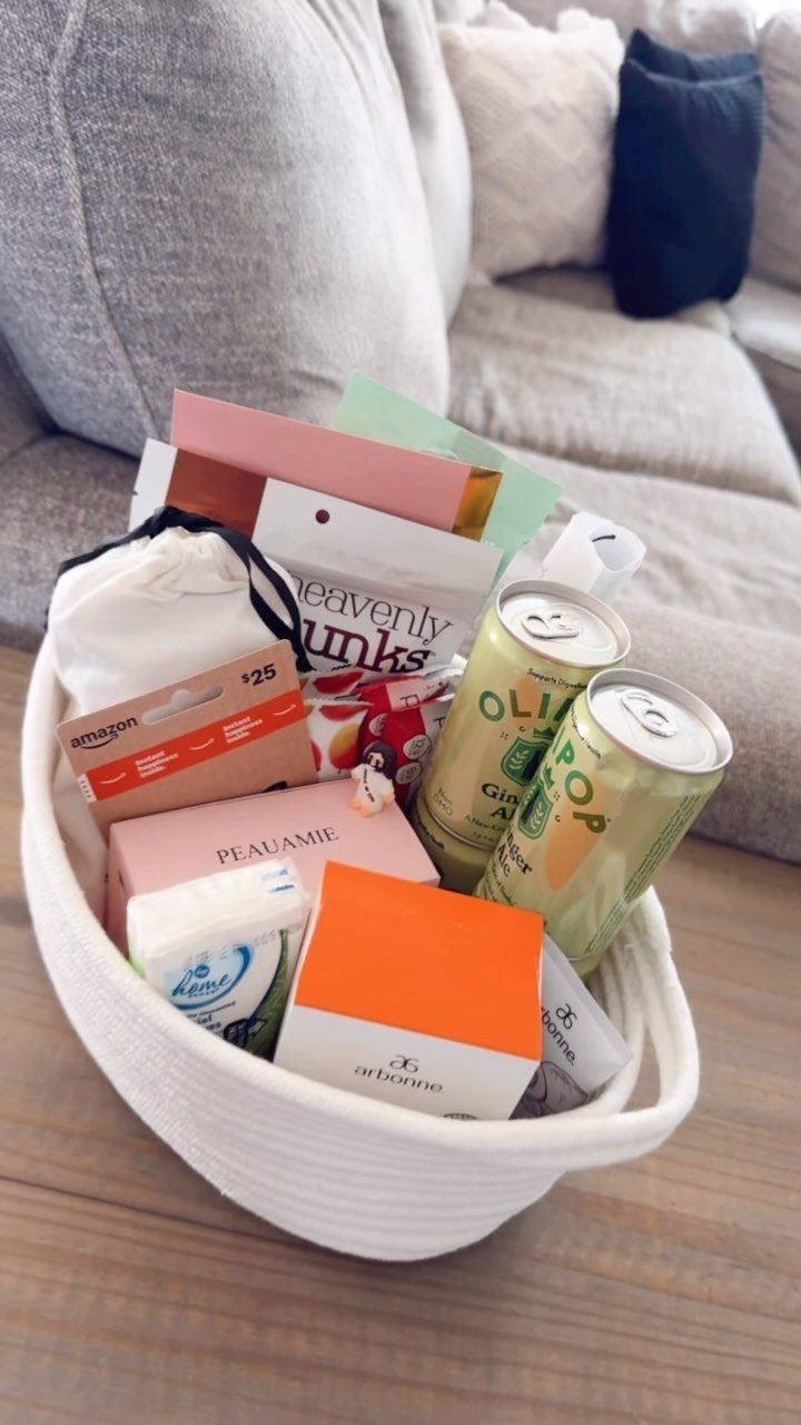 White woven basket filled with soda cans, gift cards, and skincare products.