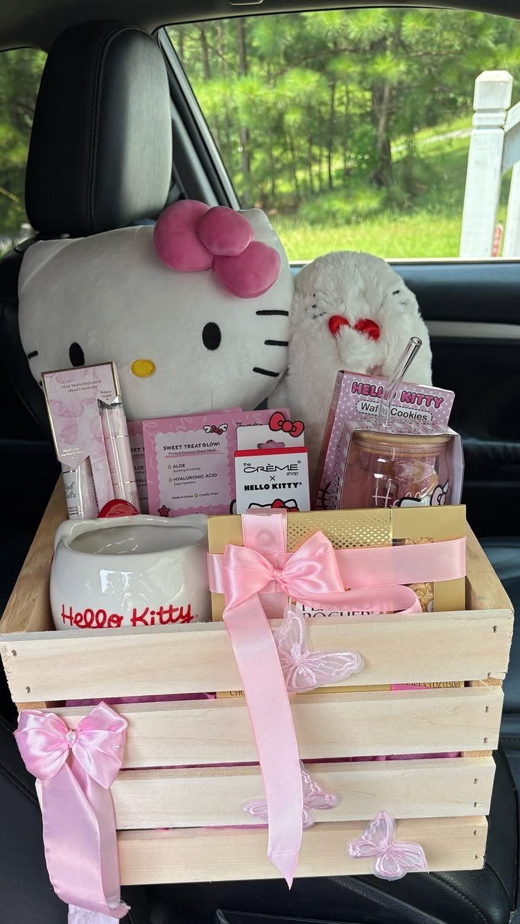 Hello Kitty themed gift basket in a wooden crate with pink ribbons