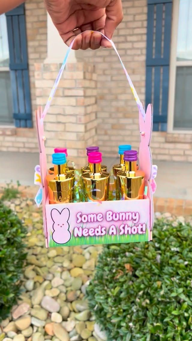 Pink bunny gift basket with miniature liquor bottles and a shot-themed sign.