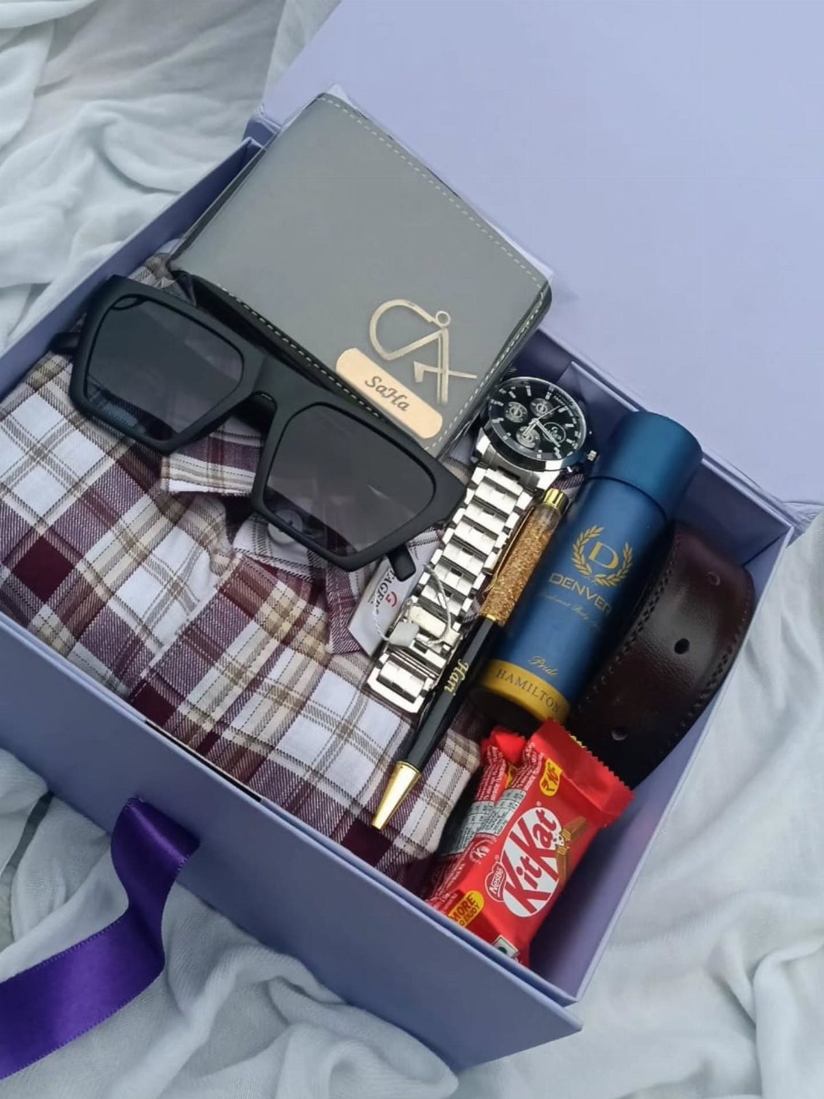 Gift box for men with wallet, watch, sunglasses, perfume, belt, and chocolate.