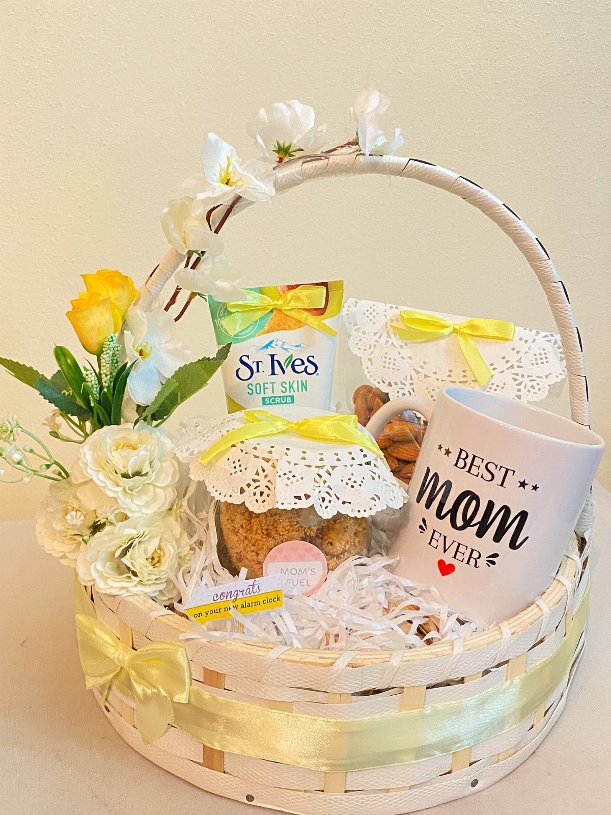 Gift basket for mom with a Best Mom Ever mug and skincare products.