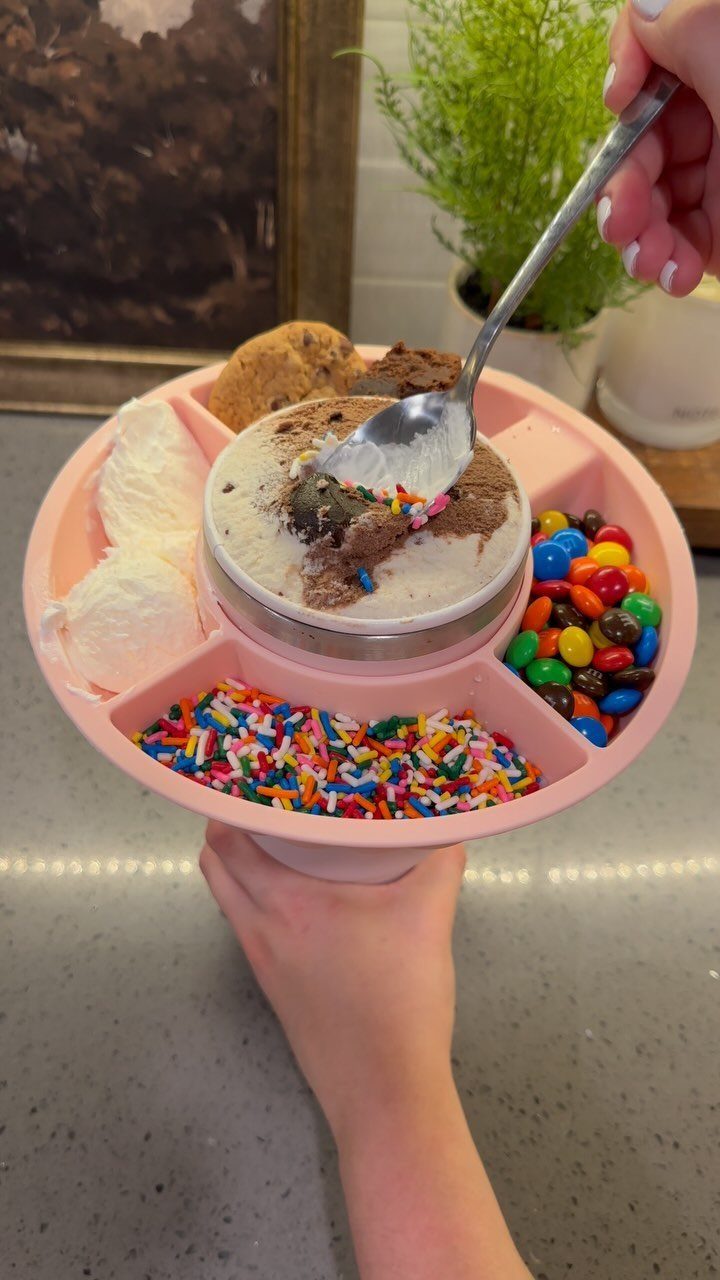 Ice cream sundae kit in a pink divided tray with colorful toppings.