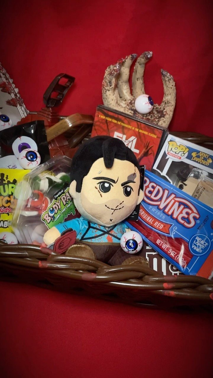 Horror movie themed gift basket with Frankenstein plush, candy, and movie memorabilia.