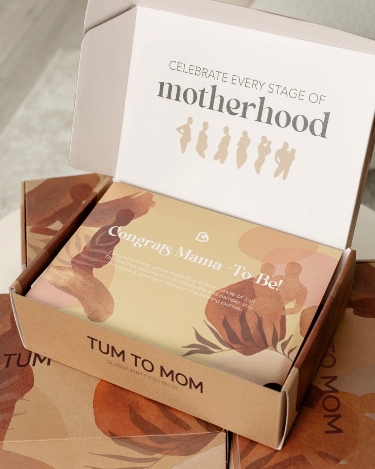 TUM TO MOM subscription box for expectant mothers with celebratory greeting card.