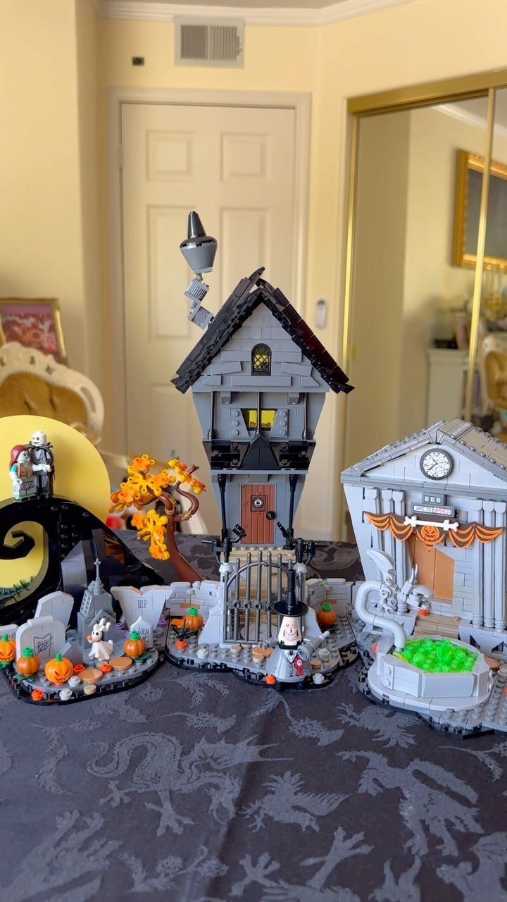 LEGO Nightmare Before Christmas sets featuring a tall house and town hall buildings.