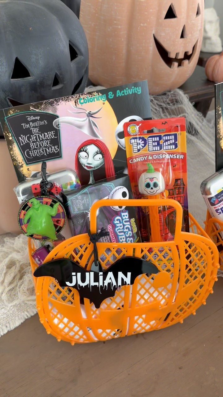 Orange Halloween basket filled with Nightmare Before Christmas themed gifts and a name tag.