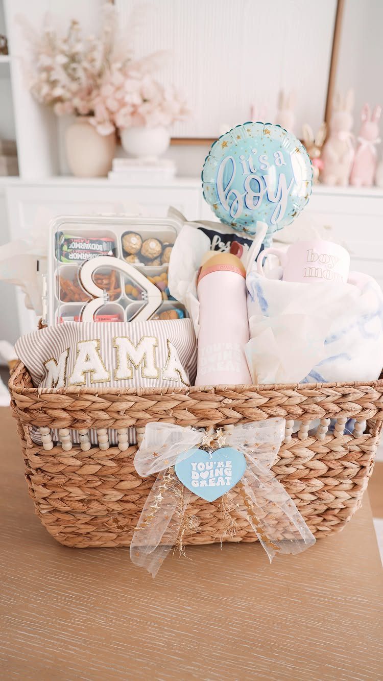 Woven gift basket for a new mother containing a mama pouch and blue balloon.