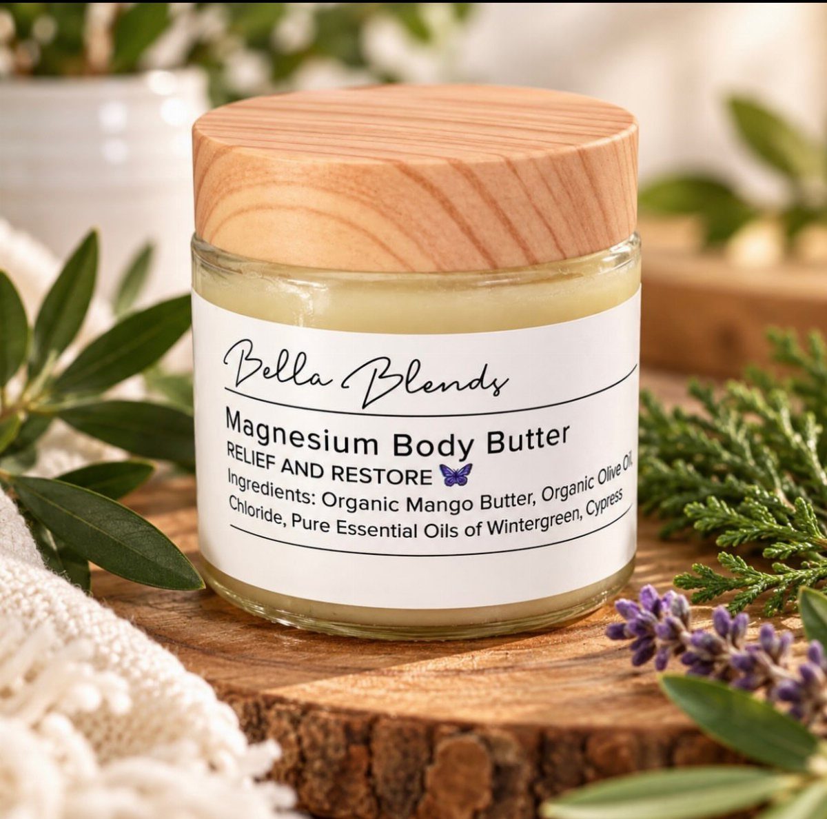 Magnesium Body Butter in a glass jar with wooden lid on a wood slice.
