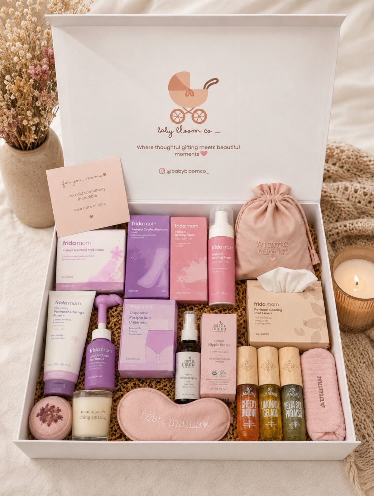 Postpartum recovery gift box containing various skincare products, essential oils, and a sleep mask.