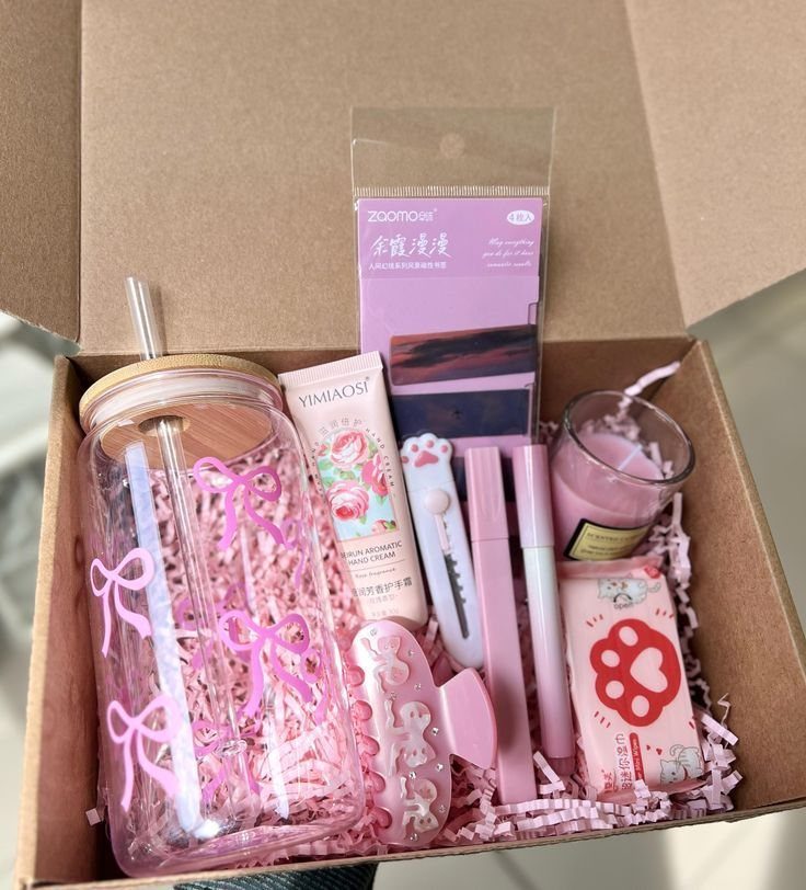 Self care gift box with pink themed beauty products and a glass jar.