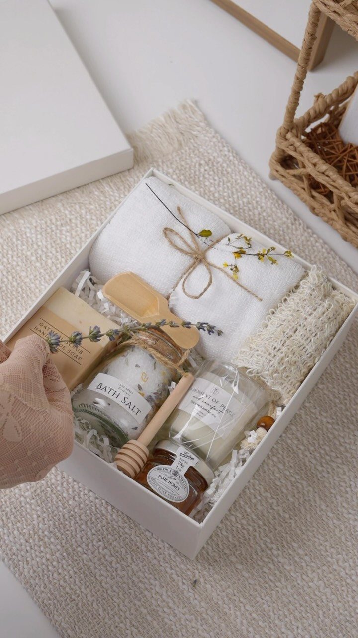 Spa gift set in a white box with towels, bath salts, and honey.