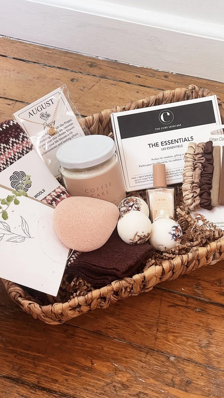 Woven wicker basket filled with skincare products, bath bombs, and a necklace.