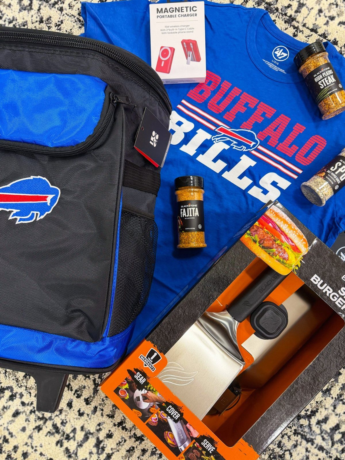 Buffalo Bills themed gift basket with cooler bag, t-shirt, and grilling accessories.