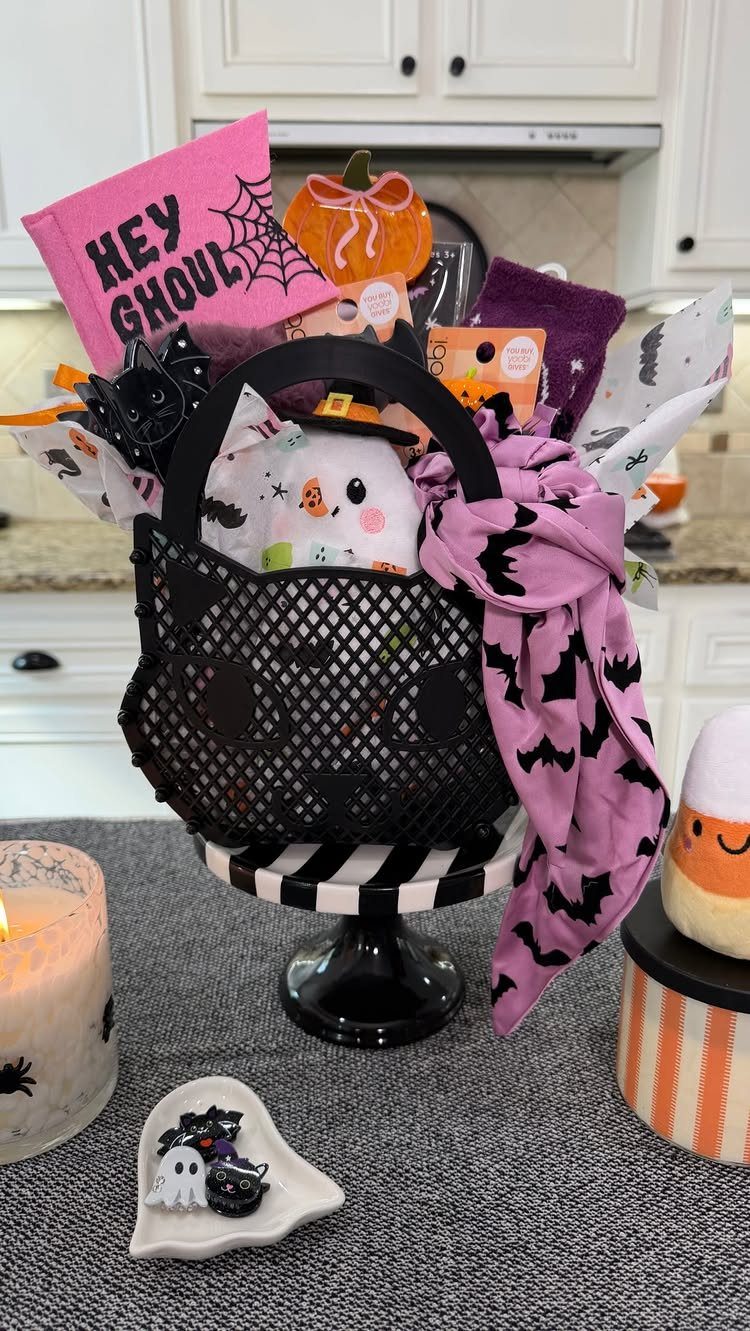 Halloween themed gift basket in a black cat container with spooky accessories