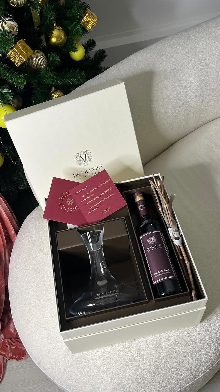 Wine gift box with a bottle of red wine and a glass decanter