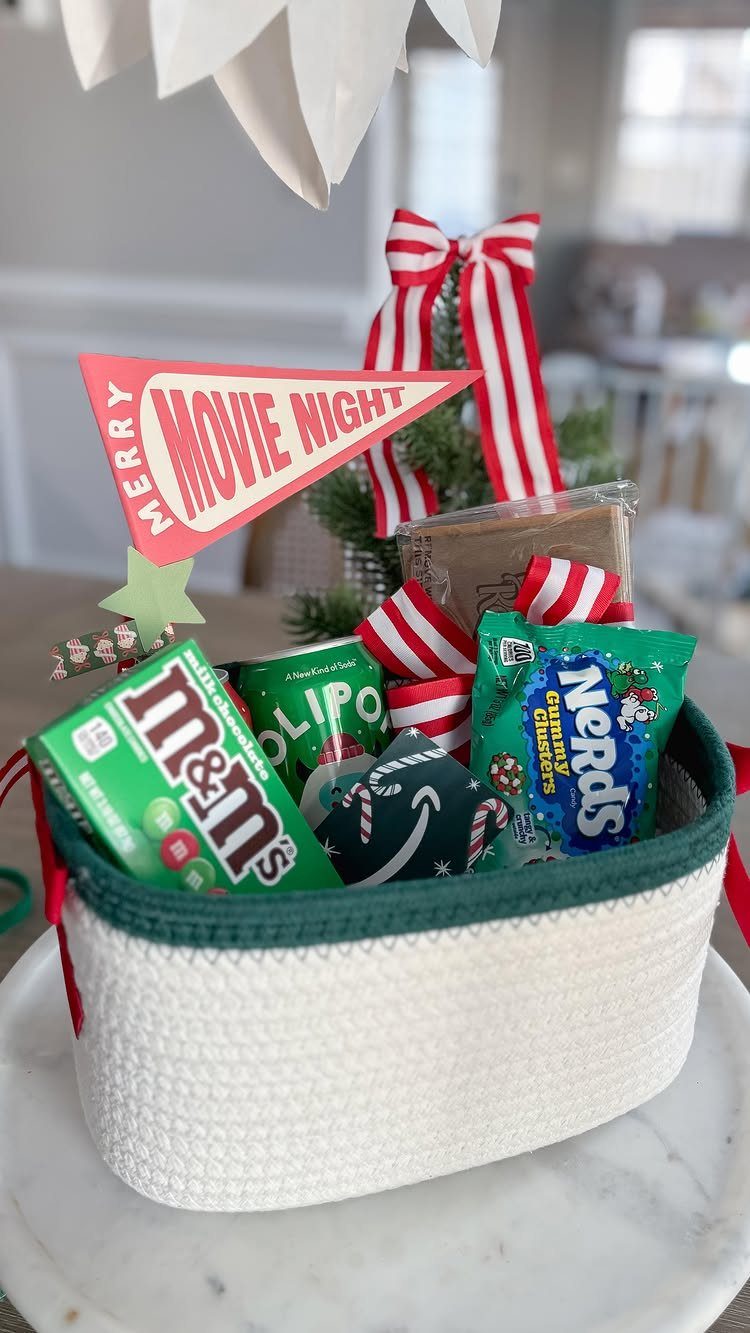 White woven gift basket with candies and a Merry Movie Night pennant flag.